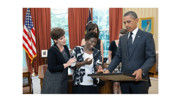 Lois Curtis, smiling, with Barack Obama