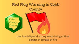 A red flag image along with a flame icon and the words Red Flag Warning in Cobb County