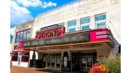 The front of the Strand Theatre, with a large old-fashioned marquee