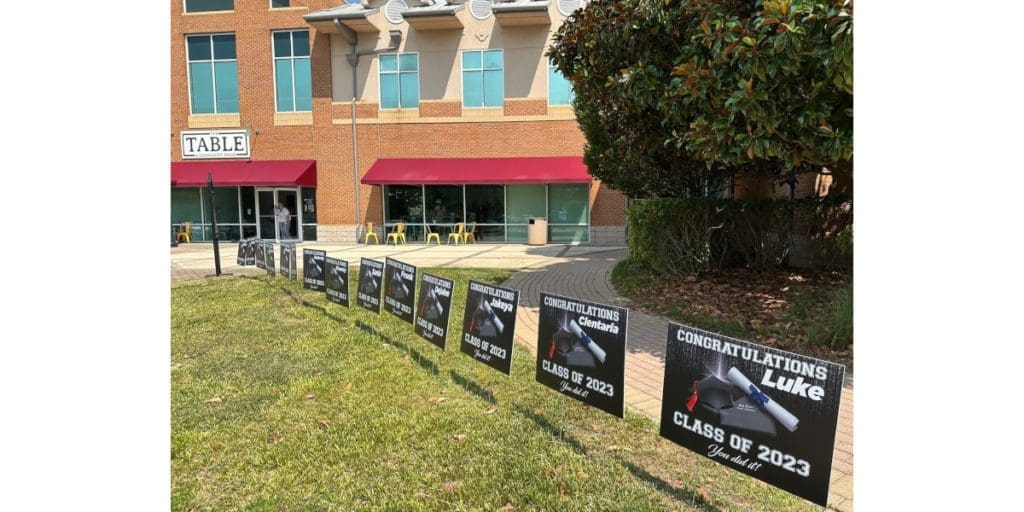 Congratulatory signs greeted the grads outside of The Table in Smyrna.