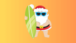 Santa in swim shorts with a surf board