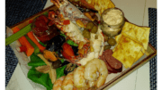 A Seacuterie (a mix of seafood and other finger foods and sauces on a board)