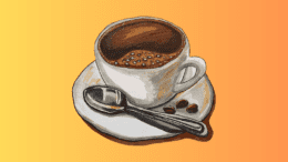 a coffee mug on a saucer with a spoon