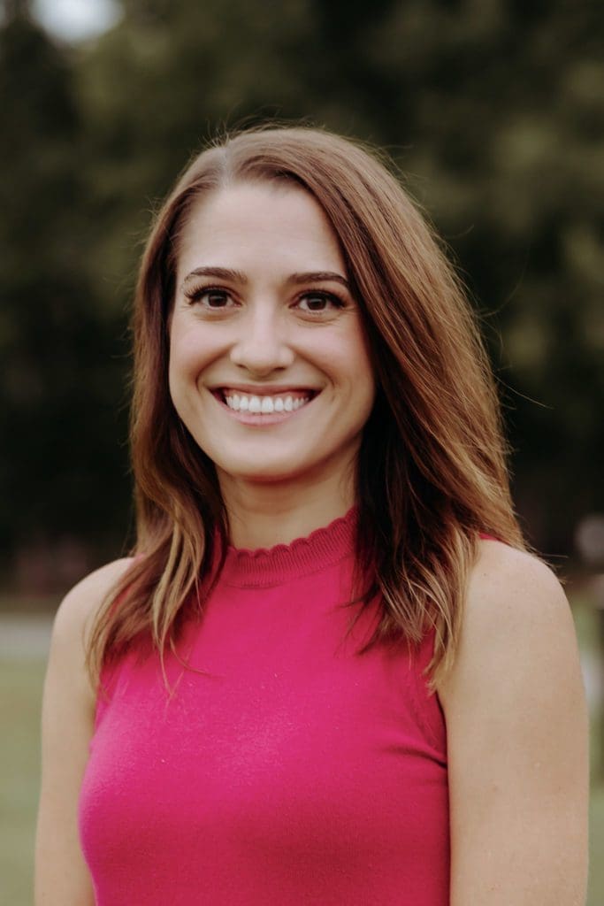 Madelyn Orochena c/o Orochena in pink blouse