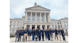A group of high school students arranged for photo in front of the Georgia Capitol