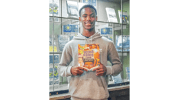 Sidney Keys III holds up book