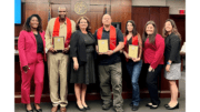 A group of Drug Treatment Court graduates and Judge Kimberly Childs and staff pose for photo