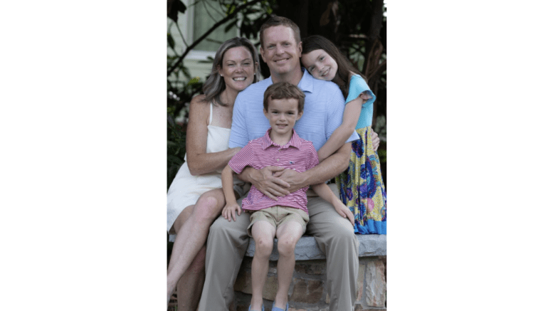 Derek Norton surrounded by his family