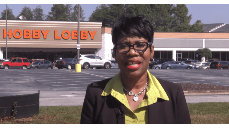 Commissioner Monique Sheffield in front of Hobby Lobby