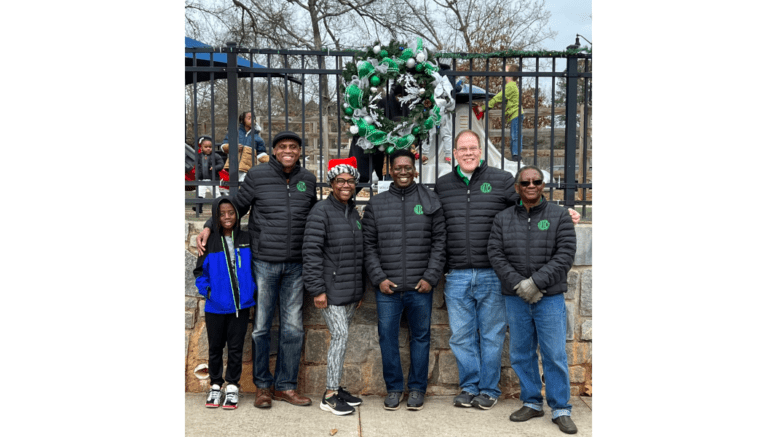 Mableton officers in front of winning wreath