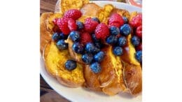 Challah with blueberry and raspberry topping