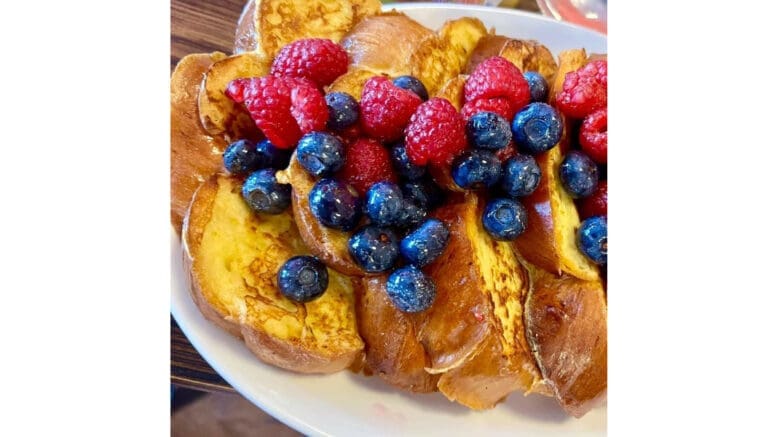 Challah with blueberry and raspberry topping