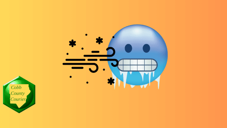 A graphic of a round face with teeth chattering and icicles hanging below as wind blows. Cobb County Courier logo in lower left corner