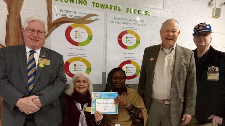 L to R: Kiwanis Club of Marietta Golden K members Jim Perry and Rosie Teague; Elayna Wilson, Principal of Powers Ferry Elementary School; Kiwanis Club of Marietta Golden K members Paul Smith, KCMGK President and member John Kone