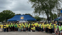 A large group in yellow safety vests