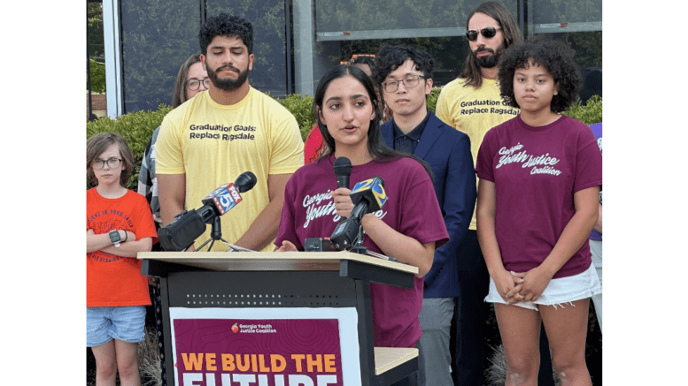 Cobb graduate Maariya Sheikh speaks in front of Cobb County school headquarters