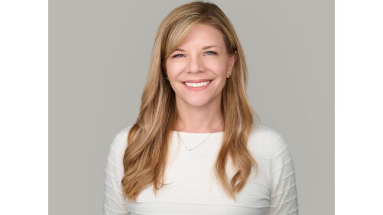 Headshot of Melissa Cantrell, smiling, wearing a white pullover