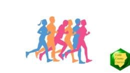 silhouettes of five runners