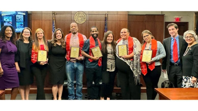 A group photo of graduates from Cobb Drug Treatment Court along with court staff and Cobb Commission JoAnn Birrell