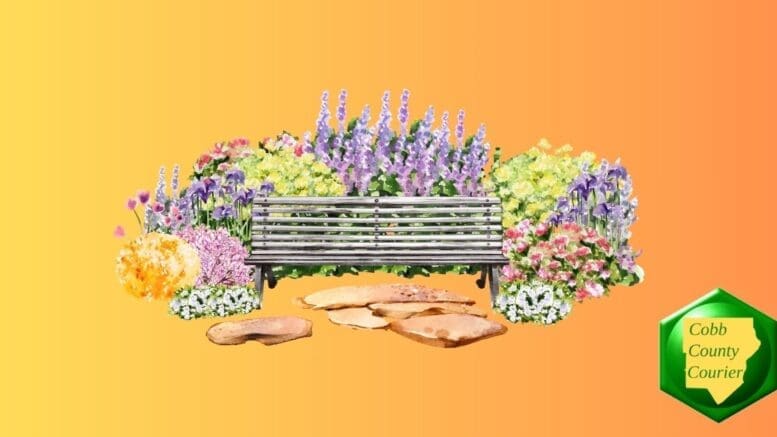 A wide array of colorful flowers behind and beside a garden bench