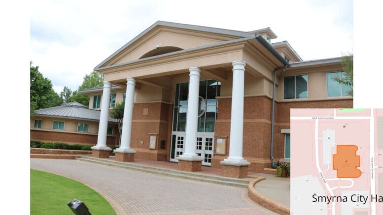 Smyrna City Hall with an inset map of the location. The building is brick, with four large white columns at a portico