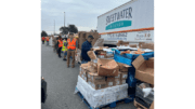 Food distribution next to a Sweetwater Mission truck