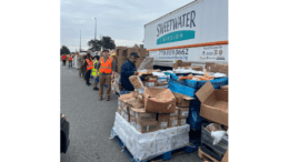 Food distribution next to a Sweetwater Mission truck