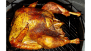 A roasted turkey on a grill