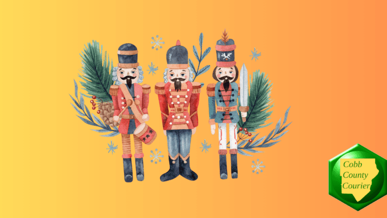 Three wooden soldiers along with holiday pine boughs