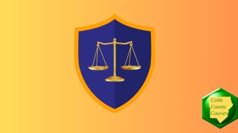 A gold scales of justice on a blue shield