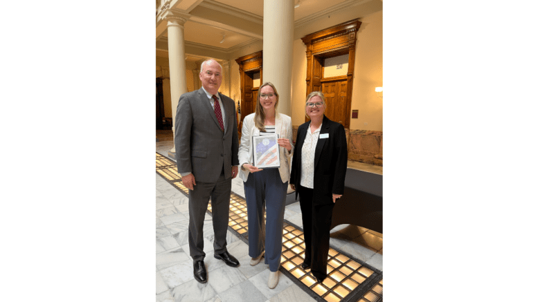 Photo: [Pictured left to right: Christopher Nunn, Commissioner of the Georgia Department of Community Affairs; Julie Barwig, Executive Director of Keep Smyrna Beautiful and Director of Environmental Services for the City of Smyrna; and Natalie Johnston-Russell, Executive Director of the Keep Georgia Beautiful Foundation at the Georgia State Capitol on February 6, 2025.]