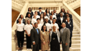 Elected officials and students at the Georgia capitol building interior stairs in group photo