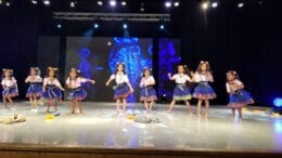A line of children dancing
