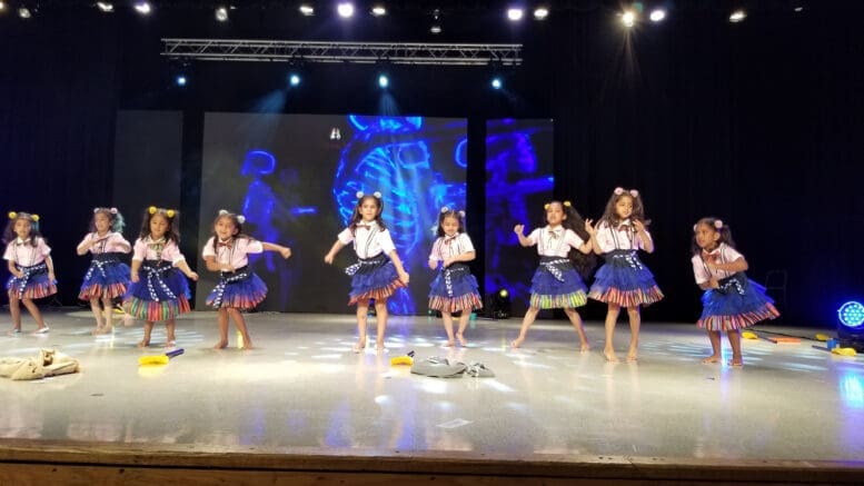 A line of children dancing