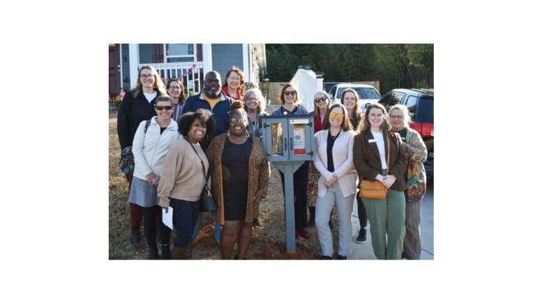 Cobb Collaborative and friends at the ribbon-cutting for a Little Free Library installation
