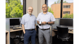 Mahmut Karakaya and Ramazan Aygun standing in office