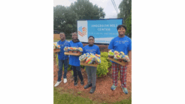 Children holding up donation flour baskets at assisted living facility