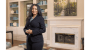 Sweta Sneha, standing,wearing a dark suit
