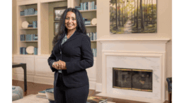 Sweta Sneha, standing,wearing a dark suit
