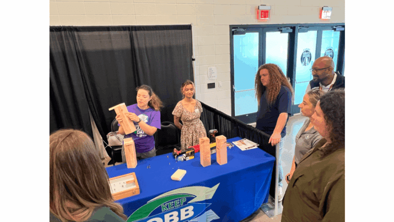 Keep Cobb Beautiful booth with bee hotel presentation