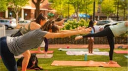 Women outdoors practicing yoga