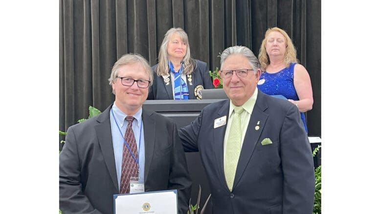 Barry Krebs accepting scrapbook award for the South Cobb Lions Club