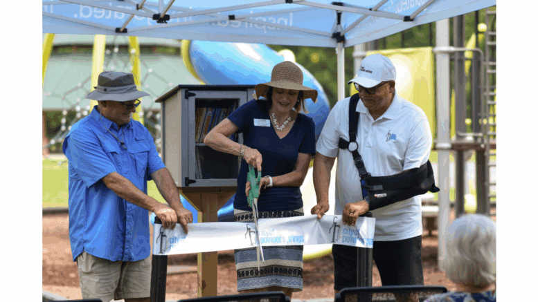Ribbon-cutting of little library kiosk