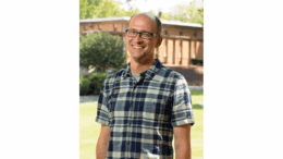 Dr. Tom Okie, outside, smiling