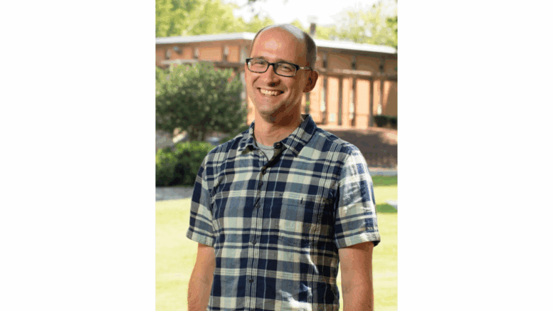 Dr. Tom Okie, outside, smiling