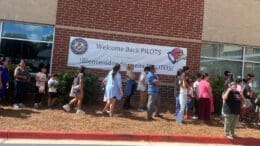 Line at Pearson Middle School back to school book bag giveaway and health fair