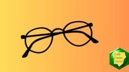 A folded pair of round eye glasses