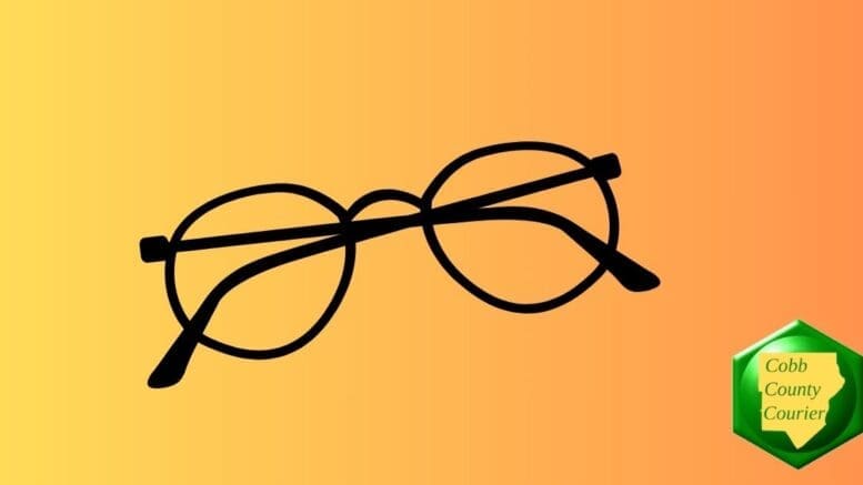 A folded pair of round eye glasses