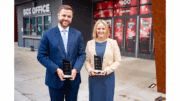 Adam Ross and Natalie DeLancey holding their Next Generation Awards