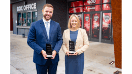 Adam Ross and Natalie DeLancey holding their Next Generation Awards